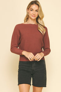 RIbbed knit sweater with boat neckline and long sleeves.