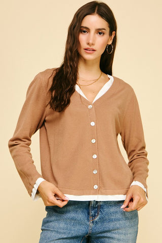 Knit and woven combo sweater with V-neck and button front.