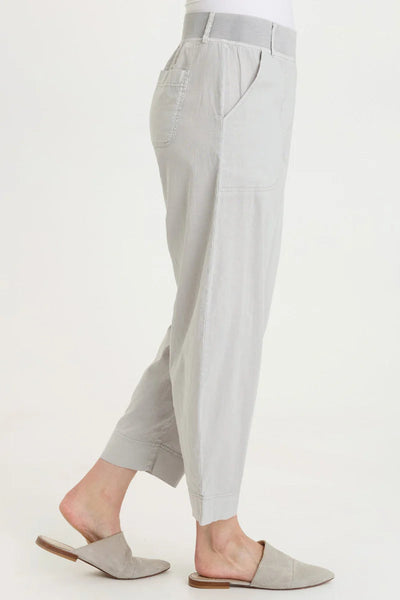 Side view of Jisola Cotton Linen Barrel Pant in Light Cool Grey highlighting the tapered barrel leg, cuffed hem, and side pocket detail.