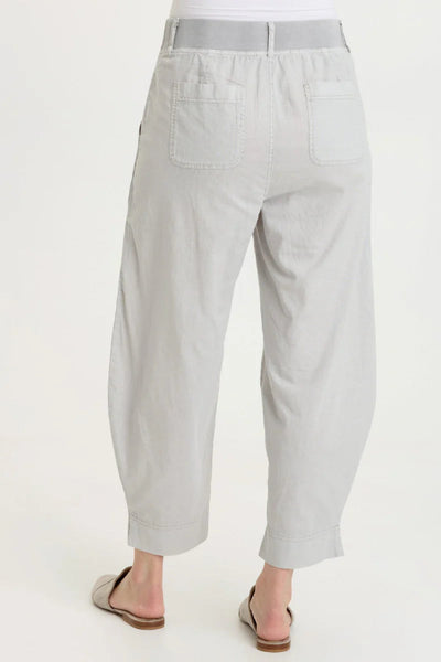 Back view of Jisola Cotton Linen Barrel Pant in Light Cool Grey showing back patch pocket, elastic waistband, and barrel leg silhouette.