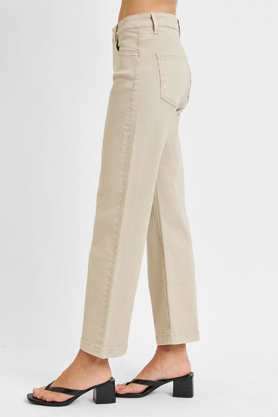 Risen Tummy Control Mid Rise Ankle Straight Jeans in khaki/sand, side view, highlighting mid rise waist, straight wide leg, and cuffed ankle hem, worn with black block heel sandals.