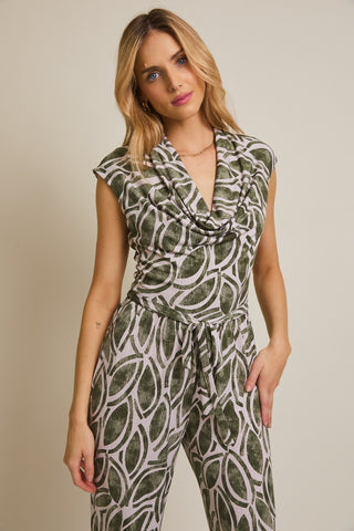 Sleeveless cowl neck jumpsuit with wide-leg pants and green abstract print.