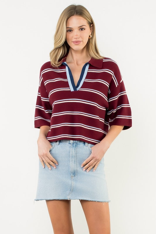 THML burgundy striped knit top with blue V-neck trim.