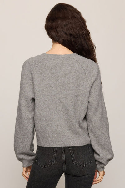 Back view of gray Z Supply Westmont Henley Sweater showing raglan sleeves and gathered cuffs. Z Supply Westmont Henley Sweater; Z Supply ZW264787; women's gray Henley sweater; women's button placket sweater; long sleeve knit Henley; cozy gray knit pullover; women's raglan sleeve sweater; cropped Henley sweater; relaxed fit Henley sweater; Z Supply women's knitwear.