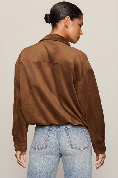 Back view of Z Supply Corbin Bubble Hem Jacket in Saddle Suede showing long sleeves and gathered bubble hemZ Supply Corbin Bubble Hem Jacket; Z Supply Saddle Suede jacket; Z Supply ZJ263172; women's faux suede jacket; brown faux suede jacket; women's bubble hem jacket; cropped faux suede jacket; collared suede look jacket; women's jacket with welt pockets; long sleeve brown jacket.