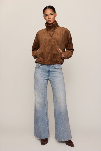 Z Supply Corbin Bubble Hem Jacket in Saddle Suede styled with wide-leg jeans and brown boots. Z Supply Corbin Bubble Hem Jacket; Z Supply Saddle Suede jacket; Z Supply ZJ263172; women's faux suede jacket; brown faux suede jacket; women's bubble hem jacket; cropped faux suede jacket; collared suede look jacket; women's jacket with welt pockets; long sleeve brown jacket.
