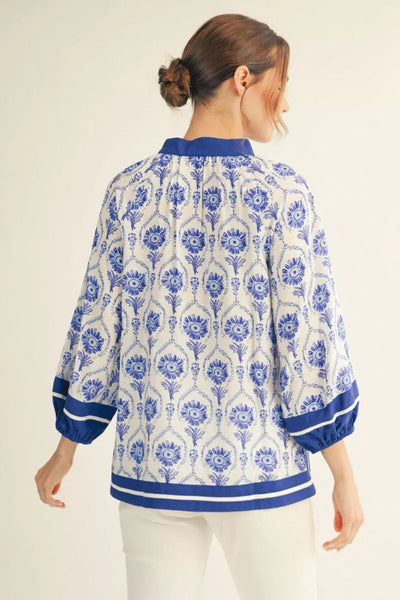 Model is wearing 3/4 Puff Sleeve Boho Print Top with contrast detail - Back view.