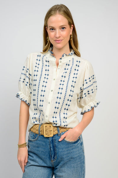 Embroidered Puff Sleeve Button Front Blouse in ivory - front view showing blue embroidery detail, stand collar, puff sleeves with ruffle trim, and relaxed fit.