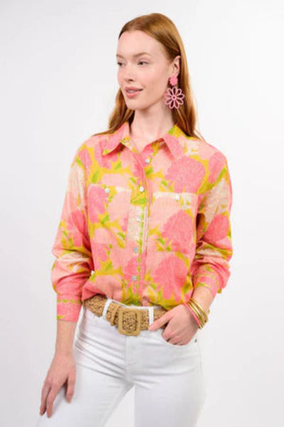 Ivy Jane Blooms A Plenty coral floral print button-front blouse styled with white jeans and a woven belt, side angle view on model