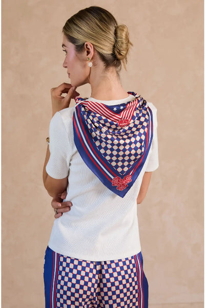 White fitted ribbed knit top with woven short sleeves and geo checkerboard navy red ivory printed scarf draped over back, back view.