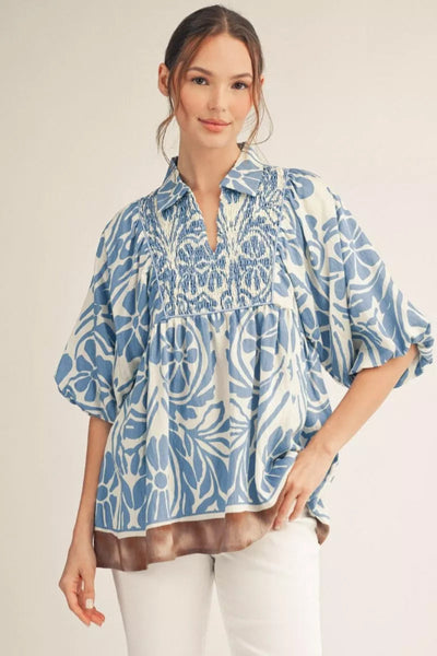 Model wearing Half Sleeve Boho Floral Print Top with smocked chest detail - front view showing blue and white floral pattern and gathered chest detail