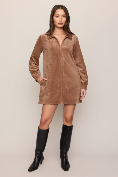 Model wearing the Z Supply Connie Walnut brown faux suede mini dress with black knee-high boots. Z Supply Connie mini dress, Z Supply Walnut dress, ZD264749 dress, brown faux suede mini dress, long sleeve suede-look dress, collared mini dress, women’s fall mini dress, stretch faux suede dress, Walnut brown mini dress, mini dress with boots.