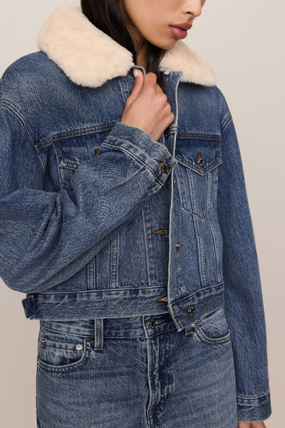 Close-up of Z Supply The Daily Denim Fur Jacket showing the cream collar, buttons, and flap chest pockets.Z Supply Daily Denim Fur Jacket
Z Supply ZJ264926 jacket
Z Supply Hush denim jacket
women’s denim jacket with removable collar
blue denim jacket with plush collar
women’s cream fur collar denim jacket
women’s cropped denim jacket
vintage wash denim jacket women
women’s cotton button front denim jacket
denim jacket for high rise jeans