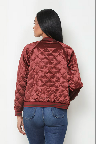 Back view of reversible burgundy satin bomber jacket showing diamond quilting and ribbed hem;reversible satin bomber jacket women; burgundy quilted bomber jacket; olive satin bomber jacket; floral embroidered bomber jacket; Paparazzi reversible jacket; women’s burgundy satin jacket; olive floral jacket women; lightweight reversible bomber jacket; vintage-inspired floral bomber jacket.
