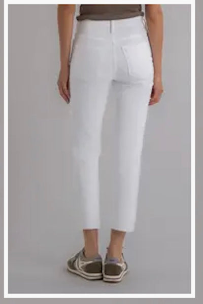 Model is wearing white pants, back view.