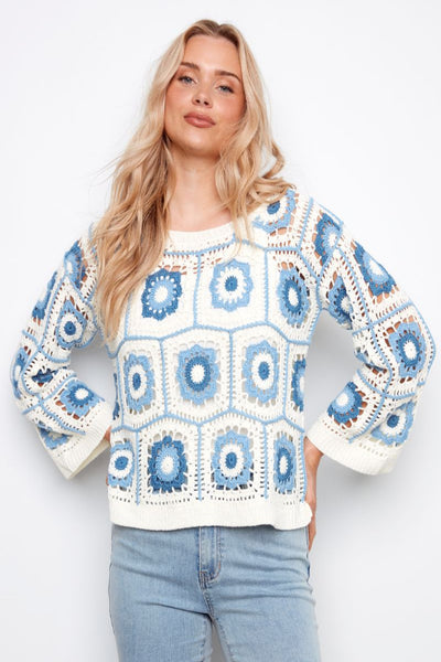 Blue and cream granny square crochet sweater with drop shoulder on model