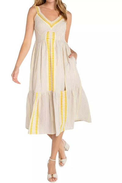 Sleeveless tiered midi dress in a cream and brown neutral stripe print, front view on model styled with strappy heeled sandals.