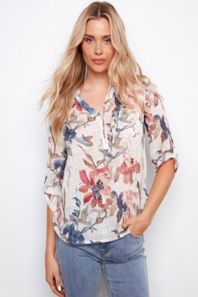 Long sleeve Floral blouse with Henley neckline paired with denim. 