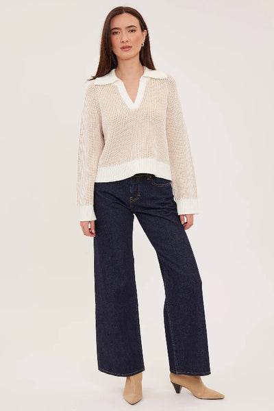 Full-length front view of cream collared Xander sweater with long sleeves, dark wide-leg jeans and beige boots;Gentle Fawn Xander sweater; Xander sweater cream; two-tone collared sweater; cream cropped sweater; women’s collared V-neck sweater; relaxed fit knit sweater; textured cream sweater; cropped sweater for high-rise jeans; Gentle Fawn two-tone sweater.