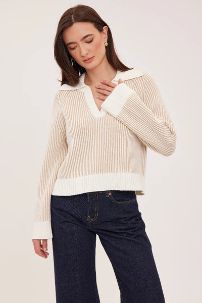 Model wearing cream two-tone ribbed Xander sweater with open collar and cropped hem, styled with dark jeans;Gentle Fawn Xander sweater; Xander sweater cream; two-tone collared sweater; cream cropped sweater; women’s collared V-neck sweater; relaxed fit knit sweater; textured cream sweater; cropped sweater for high-rise jeans; Gentle Fawn two-tone sweater.