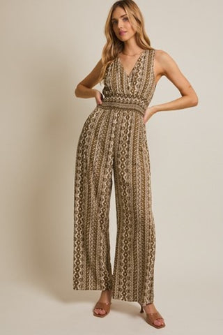  Sleeveless wide-leg boho print jumpsuit with smocked waist and V-neck.