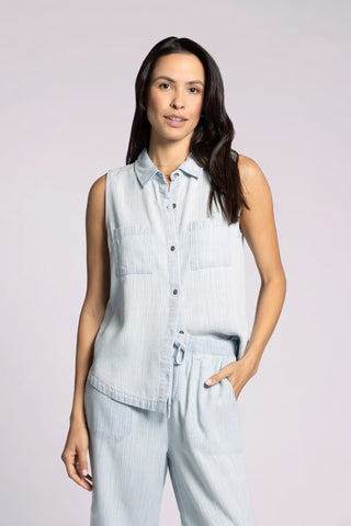 Sleeveless light blue herringbone tank top with front buttons and pockets.