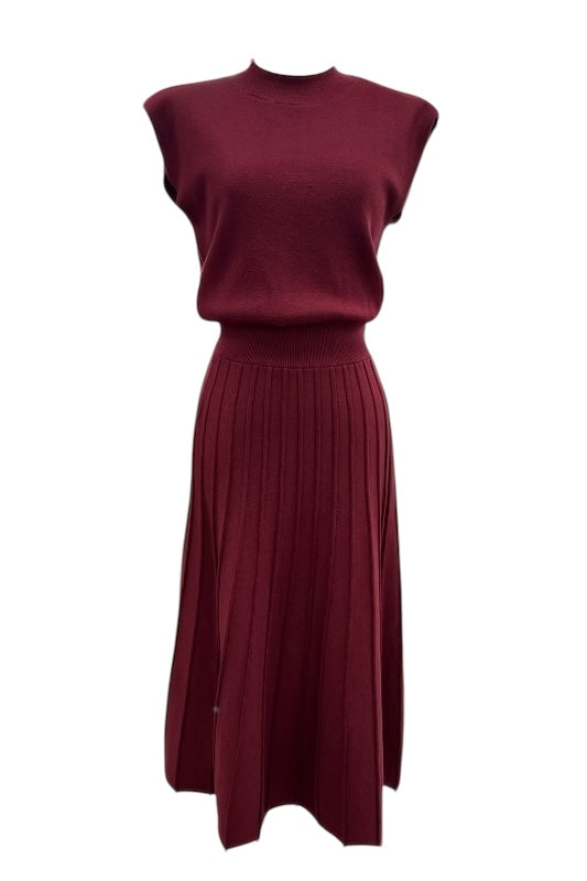 Sleeveless ribbed knit maxi dress by THML with mock neck and pleated skirt .