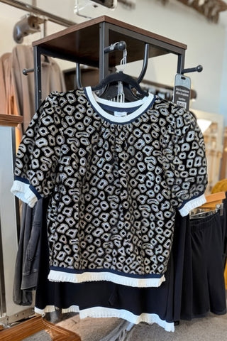 STATEMENT MAKING RUFFLED TRIM AND HEM METALLIC PRINT TOP