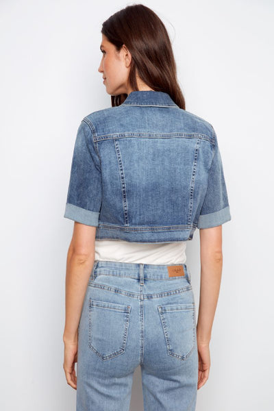 Back view of short sleeve denim jacket showing cropped length.