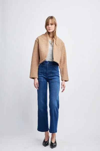 Front view of model wearing the Self Contrast Zoey crop jacket in pecan; Self Contrast Zoey crop jacket; pecan cropped jacket for women; women’s textured crop jacket; pecan fall jacket; cropped jacket for layering; women’s neutral cropped jacket; textured jacket with long sleeves; Self Contrast pecan jacket; short jacket for jeans.
