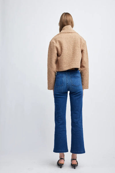 Back view of the pecan Self Contrast Zoey crop jacket on a model;Self Contrast Zoey crop jacket; pecan cropped jacket for women; women’s textured crop jacket; pecan fall jacket; cropped jacket for layering; women’s neutral cropped jacket; textured jacket with long sleeves; Self Contrast pecan jacket; short jacket for jeans.