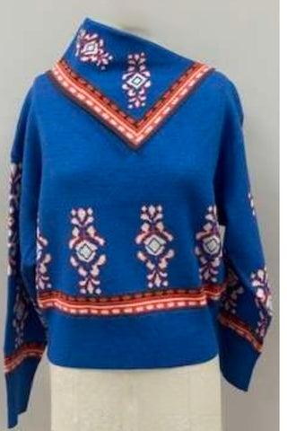 Cobalt blue long sleeve sweater with red and white geometric print and foldable neckline.
