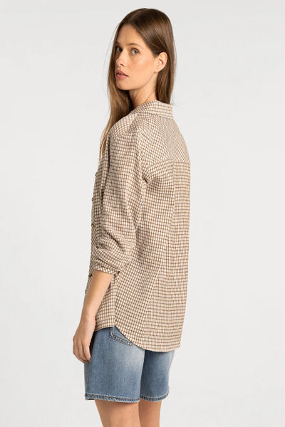 Back and side view of Thread & Supply Navigator Top in Ivory Tan Plaid showing longline fit and shirttail hem.Thread & Supply Navigator Top, Thread and Supply plaid shirt, Ivory Tan Plaid shirt, women’s cotton plaid button-up, relaxed fit plaid shirt women, longline cotton shirt, neutral plaid button-up shirt, women’s long sleeve cotton shirt, collared plaid layering shirt, shirttail hem button-up.