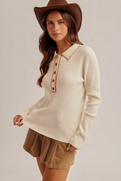 embroidered collar polo sweater
ribbed knit polo sweater women
cream polo sweater long sleeve
western style knit sweater
whipstitch collar sweater
half button placket sweater top
Hem and Thread sweater
cotton nylon ribbed sweater
boho western sweater top
fitted ribbed knit top women