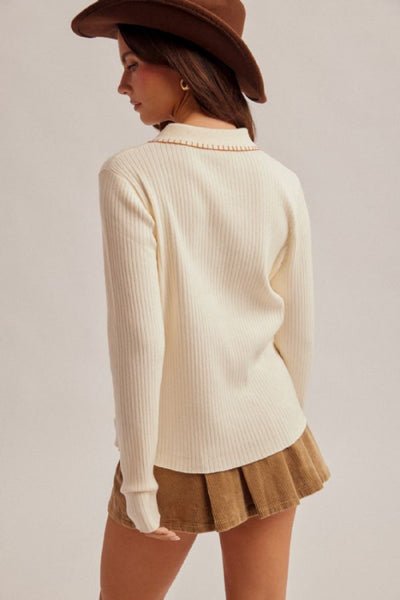 embroidered collar polo sweater
ribbed knit polo sweater women
cream polo sweater long sleeve
western style knit sweater
whipstitch collar sweater
half button placket sweater top
Hem and Thread sweater
cotton nylon ribbed sweater
boho western sweater top
fitted ribbed knit top women