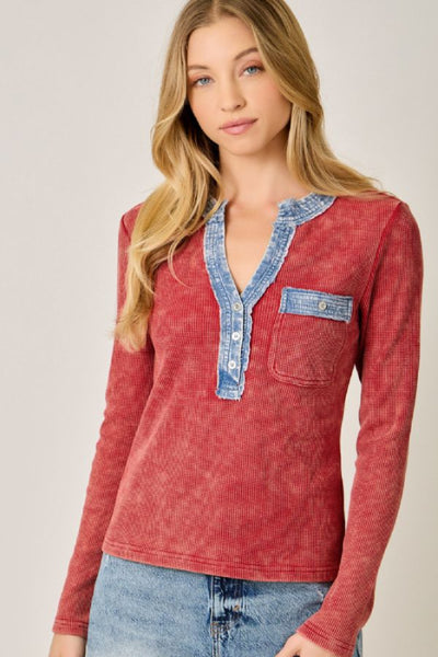 Denim Mixed Henley Top in washed red, front view showing button-trim V-neckline, denim contrast trim, chest pocket, and ribbed knit texture with denim shorts.