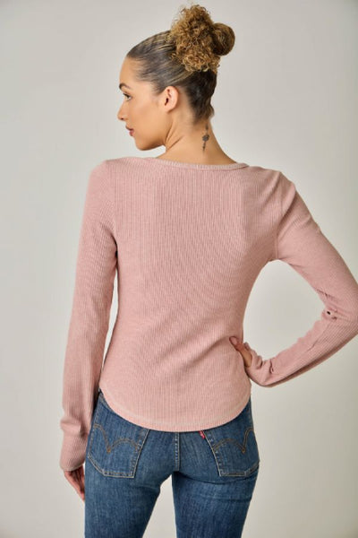 Back view of the Mystree vintage rose ribbed Henley top showing long sleeves and a curved hi-lo hem.Mystree vintage rose Henley top; women's blanket stitch Henley; vintage rose long sleeve top; ribbed Henley top for women; women's top with thumb holes; Mystree 71262 top; pink ribbed long sleeve shirt; blanket stitch knit top; women's hi-lo hem top; stretchy long sleeve layering top.