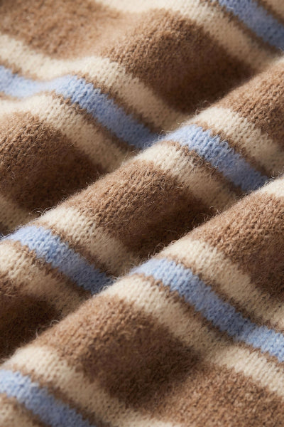 Close-up of the Z Supply Medina cardigan knit texture with Golden Caramel, cream, and pale blue stripes.Z Supply Medina Stripe Cardigan; Z Supply Golden Caramel cardigan; ZW263330 cardigan; women’s caramel striped cardigan; cream and blue stripe cardigan; crew neck button front cardigan; Z Supply Cozy Spring Yarns cardigan; women’s short knit cardigan; striped cardigan for high-rise jeans.