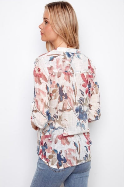 Back view of Long sleeve Floral blouse  paired with denim. 
