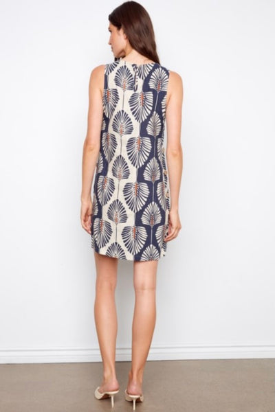 Back View Navy and cream palm leaf printed sleeveless linen blend shift dress with crew neckline and decorative side button detail.