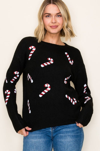Crewneck Christmas sweater featuring all-over candy cane sequin accents.