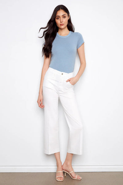 White cropped wide-leg stretch twill pants with rectangular patch pockets and regular rise, styled with strappy heeled sandals and a blue tee, front view.