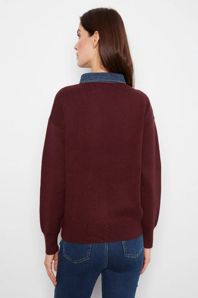 Back view of Charlie B merlot sweater with denim blue collar and ribbed cuffs and hem. Charlie B denim trim polo sweater; Charlie B merlot sweater; women’s merlot polo sweater; denim collar sweater women; burgundy sweater with denim collar; women’s snap placket sweater; relaxed fit polo sweater women; long sleeve collared knit sweater; women’s drop shoulder sweater; Charlie B fall knitwear.