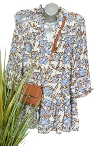 Blue and brown flower print dress with ruffle trim sleeves, and v-neckline styled with a leather cross body bag (not included). 