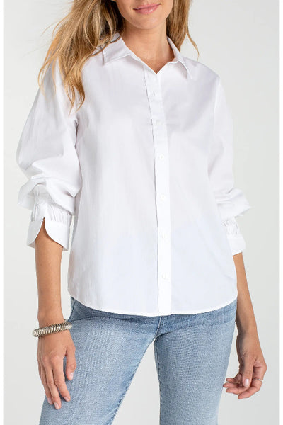Model is wearing a white Liverpool Adjustable Sleeve Button Front Woven Top with spread collar and scrunched three-quarter sleeves, front view, styled with light wash jeans
