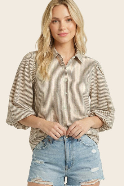 Staccato Bubble Sleeve Button-Down Striped Shirt in brown and cream ticking stripe, collared neckline, button-front closure, relaxed boxy fit, 3/4 bubble sleeves — front view on model styled with distressed denim shorts.