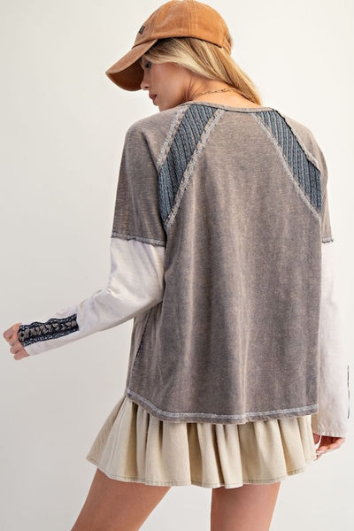 Back view of a slub cotton top with textured shoulder insets and raw edge seams.