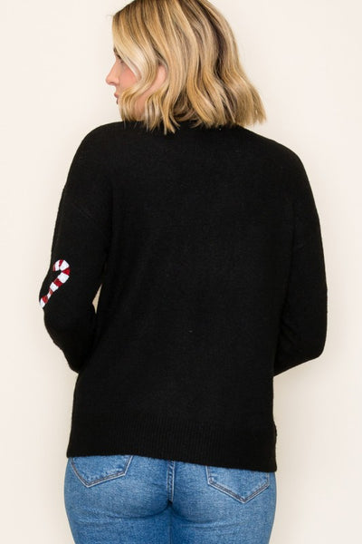 Crewneck Christmas sweater featuring all-over candy cane sequin accents.