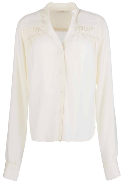 Top with trim and shirring in ivory - front view showing V-neckline, button-front closure, shirring detail at shoulders, and relaxed boxy fit