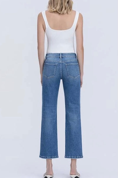 VERVET mid-rise ankle straight jeans in medium wash with white tank top and strappy sandals — back view
